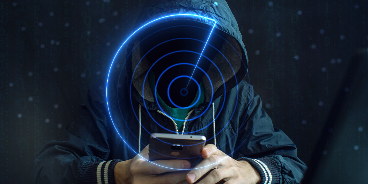 Hooded hacker with phone - enterprise impersonation